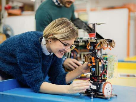 researcher with robot